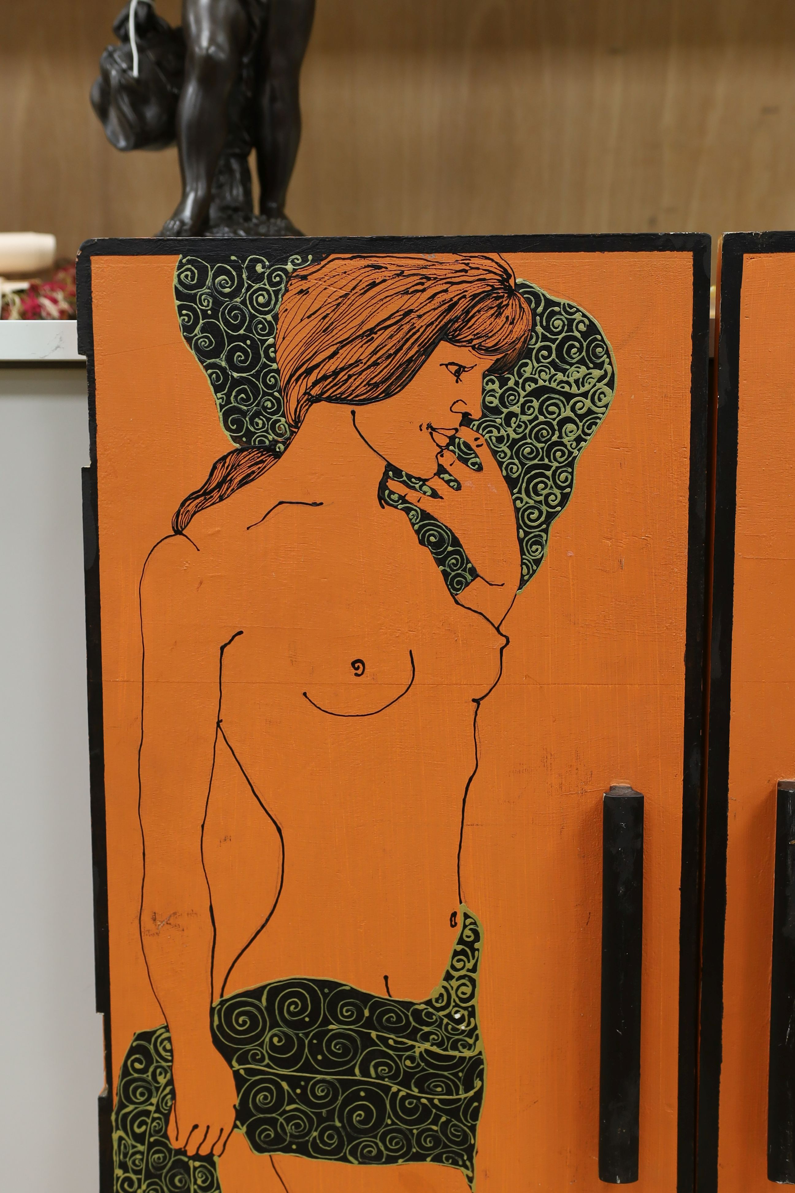 A pair of orange painted figural 1960's cabinet doors, by repute from 'Biba', 36cms wide x94 cms high.